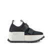 Zapatilla deportiva para mujer en blanco y negro.